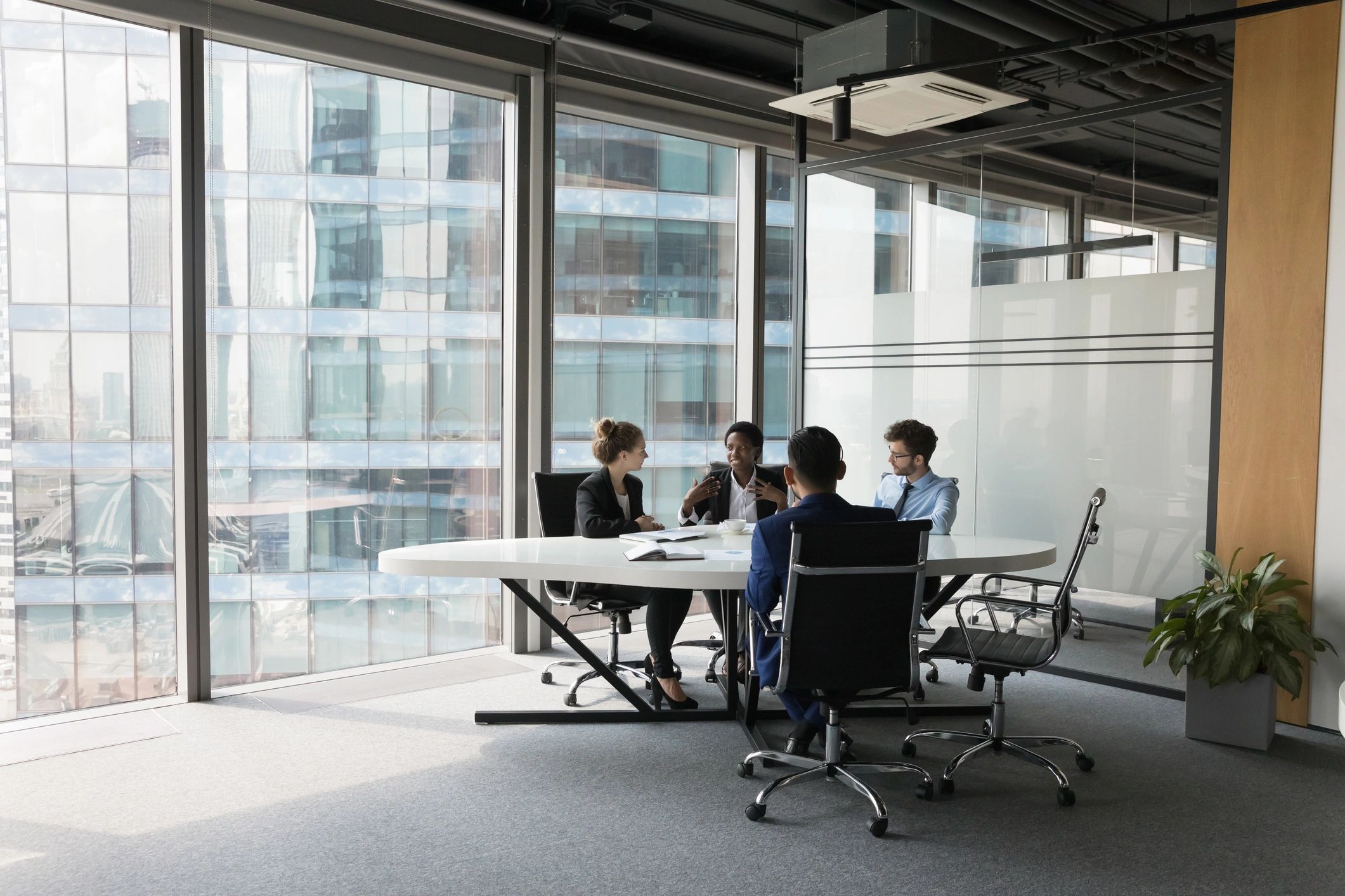 Business team in a meeting room discussing a project